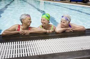 Smiling senior women in pool